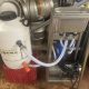 Twin nozzle bottle rinser